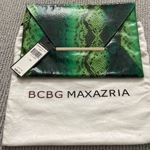 BCBG Brand New snake skin clutch! Original duster. Color emerald green